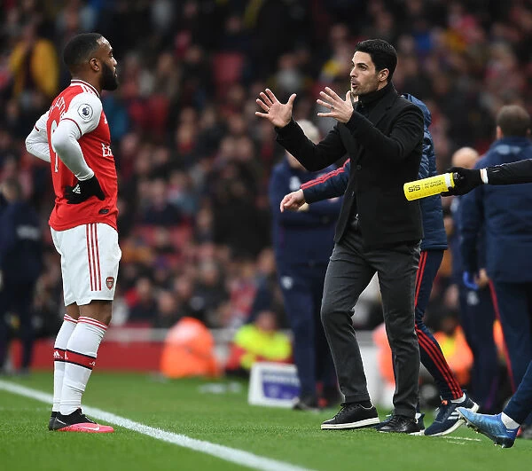 Arsenal's Mikel Arteta Coaches Alexis Lacazette Amidst Premier League Clash Against West Ham