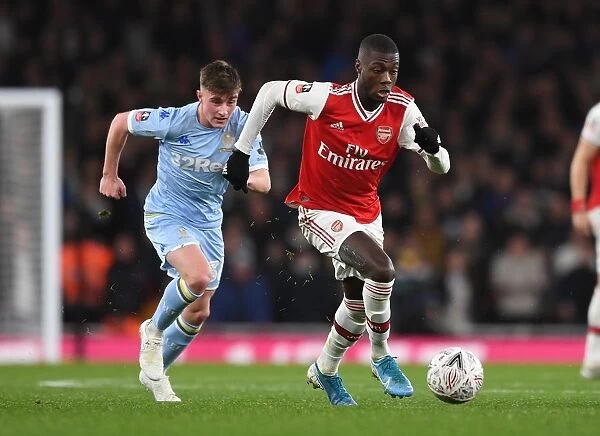 Arsenal's Nicolas Pepe Clashes with Leeds Robbie Gotts in FA Cup Third Round