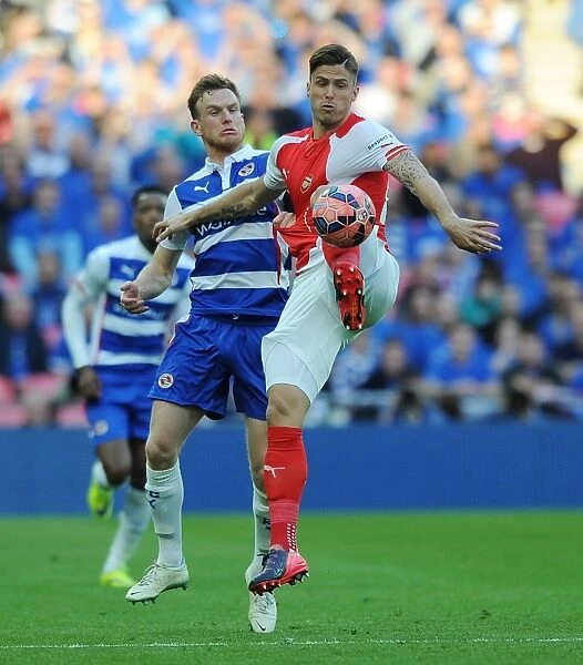 Arsenal's Olivier Giroud Battles Reading's Alex Pearce in FA Cup Semi-Final Clash