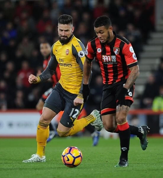 Arsenal's Olivier Giroud Closes In on AFC Bournemouth's Joshua King in Intense Premier League Clash (2016-17)