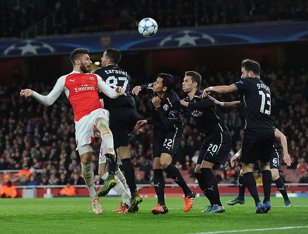 Arsenal's Olivier Giroud Faces Intense Pressure from Dinamo Zagreb Defenders During UEFA Champions League Clash