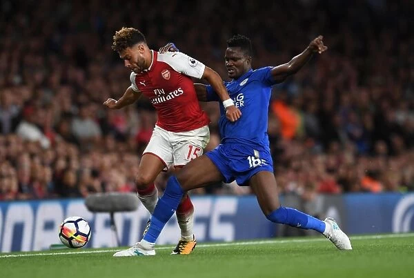 Arsenal's Oxlade-Chamberlain Clashes with Leicester's Amartey in Premier League Showdown