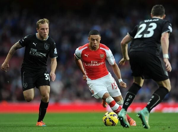 Arsenal's Oxlade-Chamberlain Faces Off Against Burnley's Arfield and Ward