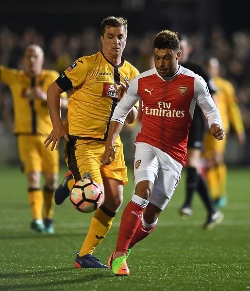 Arsenal's Oxlade-Chamberlain Faces Off Against Sutton United's Collins in FA Cup Fifth Round Clash