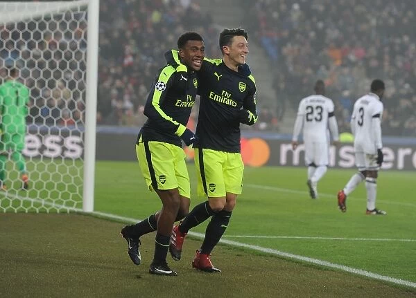 Arsenal's Ozil and Iwobi Celebrate Goals Against FC Basel in 2016-17 UEFA Champions League