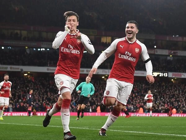Arsenal's Ozil and Kolasinac: Unstoppable Duo Celebrates Fourth Goal vs. Huddersfield Town (2017-18)