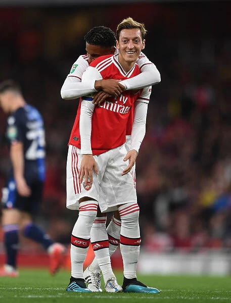 Arsenal's Ozil and Nelson in Action: Battling Nottingham Forest in Carabao Cup Clash