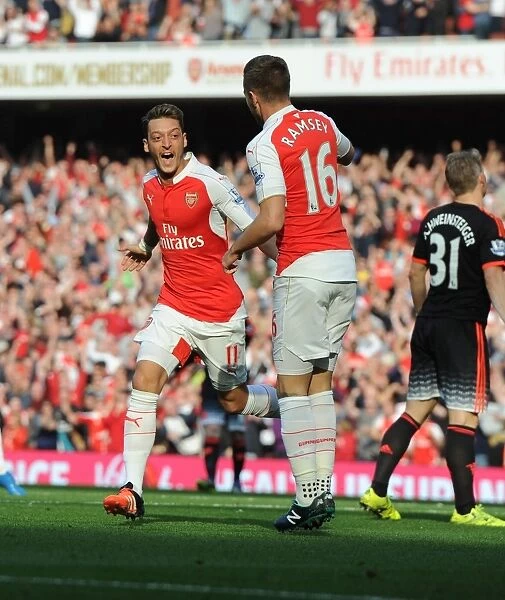 Arsenal's Ozil and Ramsey Celebrate Double Strike Against Manchester United (2015 / 16)
