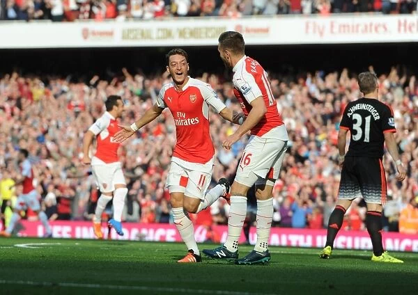 Arsenal's Ozil and Ramsey Celebrate Goals Against Manchester United (2015 / 16)