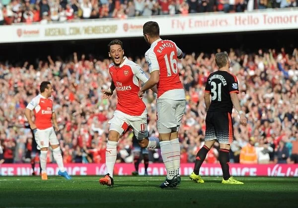Arsenal's Ozil and Ramsey: Celebrating Goals Against Manchester United in the 2015 / 16 Premier League