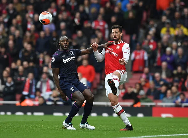 Arsenal's Pablo Mari Stands Firm Against Michail Antonio's Pressure in Intense Premier League Clash