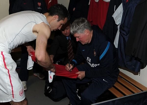 Arsenal's Pat Rice Signs Robin van Persie's Shirt after West Bromwich Albion Match (2011-12)
