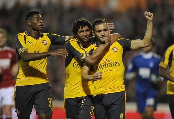 Arsenal's Perez, Reine-Adelaide, and Elneny Celebrate Goals Against Nottingham Forest in EFL Cup