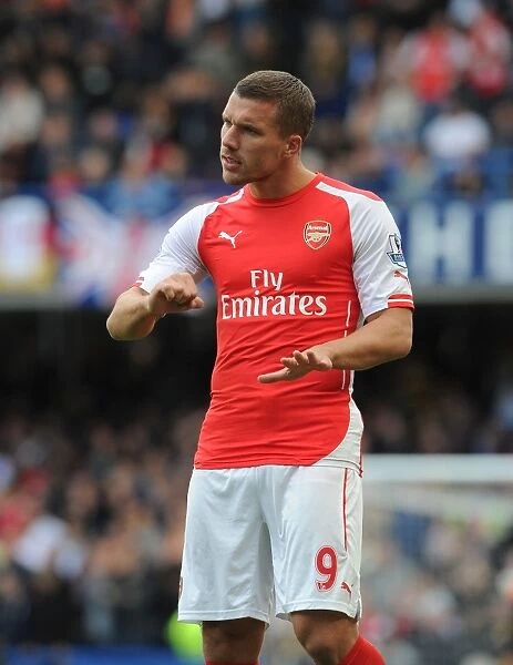 Arsenal's Podolski Faces Off Against Chelsea at Stamford Bridge (2014-15 Premier League)
