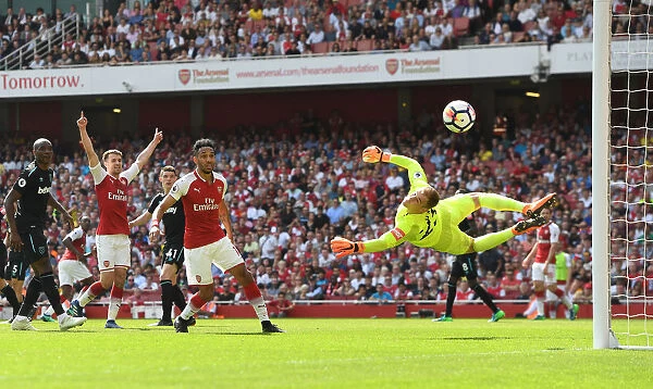 Arsenal's Ramsey and Aubameyang vs. West Ham's Hart: Intense Moment from the Premier League Clash