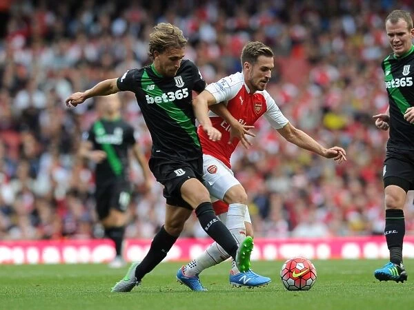Arsenal's Ramsey Battles Past Stoke's Muniesa in 2015-16 Premier League Showdown