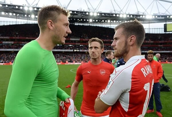 Arsenal's Ramsey and Monreal Converse with Bendtner of Wolfsburg Post-Emirates Cup Match