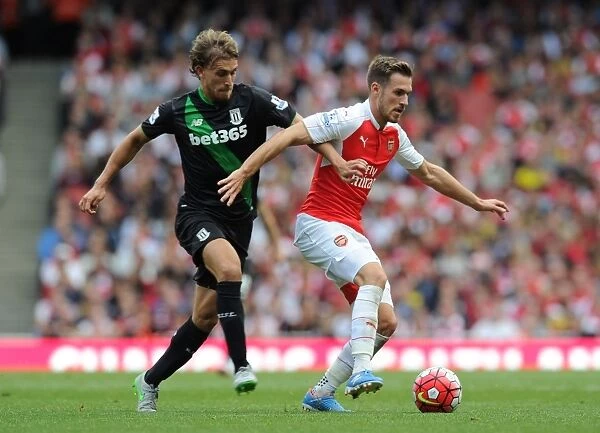 Arsenal's Ramsey Outmuscles Stoke's Muniesa in Intense 2015-16 Premier League Clash