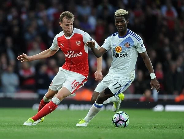 Arsenal's Rob Holding Clashes with Sunderland's Didier Ndong in Premier League Showdown