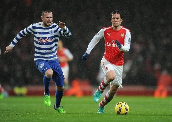 Arsenal's Rosicky Clashes with QPR's Mutch in Premier League Showdown