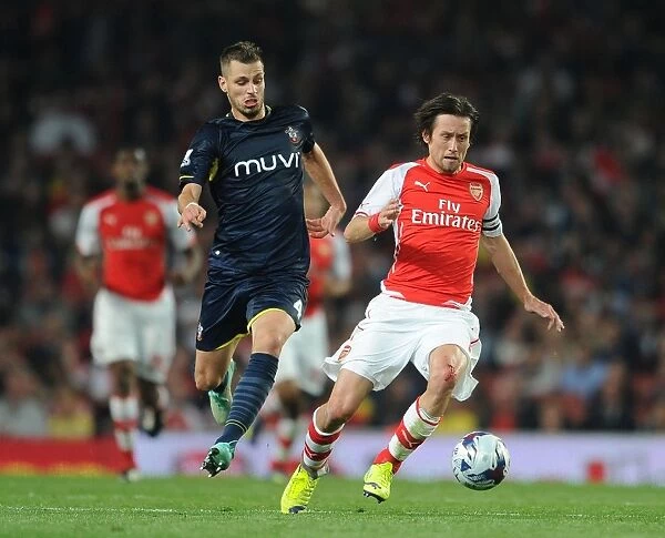 Arsenal's Rosicky Faces Off Against Southampton's Schneiderlin in League Cup Clash