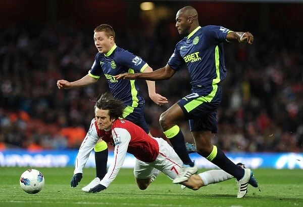 Arsenal's Rosicky Fouls by Wigan's Boyce in Premier League Clash (2012)