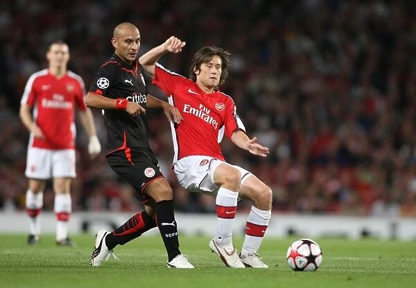 Arsenal's Rosicky and Ledesma Clash in Group H Showdown: Arsenal 2-0 Olympiacos, UEFA Champions League, Emirates Stadium, 2009