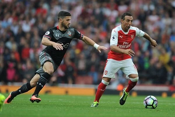 Arsenal's Santi Cazorla vs. Southampton's Shane Long: Intense Clash in 2016-17 Premier League Match