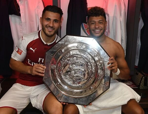 Arsenal's Sead Kolasinac and Alex Oxlade-Chamberlain Celebrate FA Community Shield Victory with the Trophy