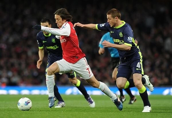 Arsenal's Tomas Rosicky Outmaneuvers Wigan's James McCarthy