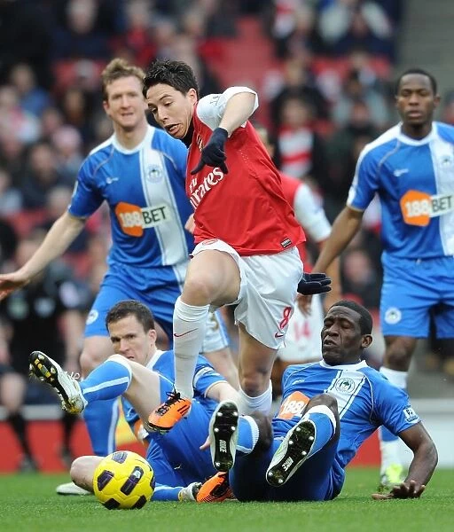Arsenal's Triumph: Nasri's Brilliance Leads to 3-0 Win Over Wigan's Caldwell and Thomas