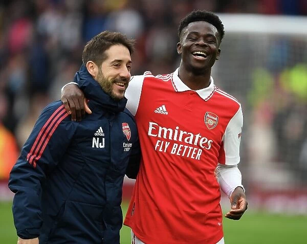 Arsenal's Triumph: Nico Jover and Bukayo Saka Celebrate in the Premier League 2022-23