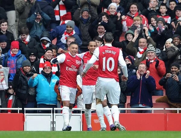 Arsenal's Triumph: Oxlade-Chamberlain, Walcott, and van Persie Celebrate Goals Against Blackburn Rovers