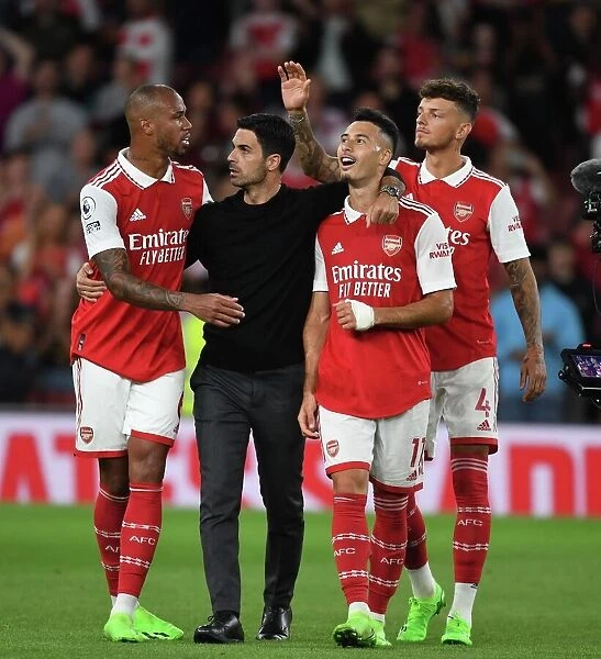 Arsenal's Triumphant Team: Arteta, Gabriel, Martinelli, and Ben White Celebrate Victory over Aston Villa (2022-23)