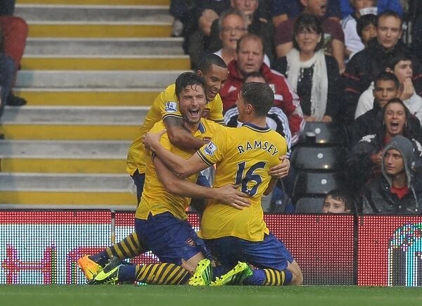 Arsenal's Triumphant Threesome: Giroud, Walcott, Ramsey Celebrate First Goal vs. Fulham (2013-14)
