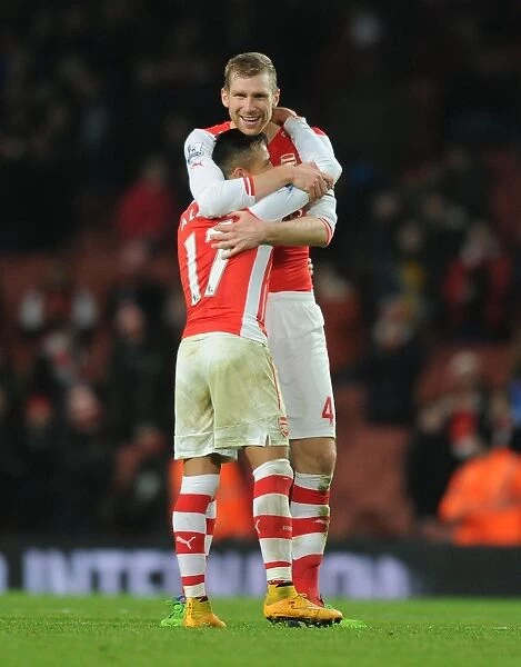 Arsenal's Unstoppable Duo: Sanchez and Mertesacker Celebrate Victory (2014-15)
