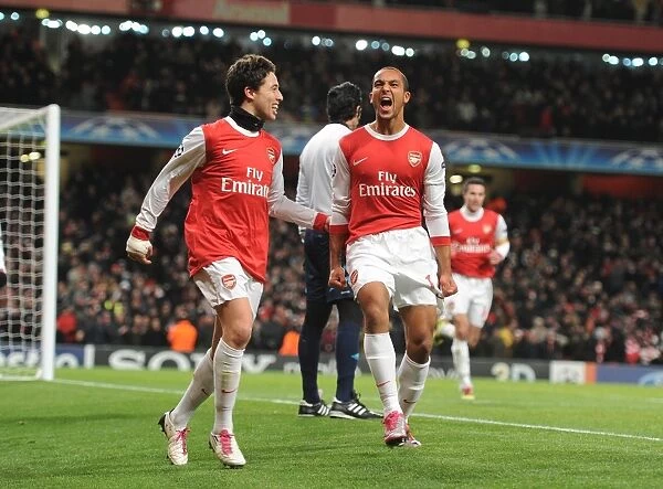 Arsenal's Unstoppable Duo: Walcott and Nasri Celebrate Goals in Arsenal's 3-1 UEFA Champions League Victory