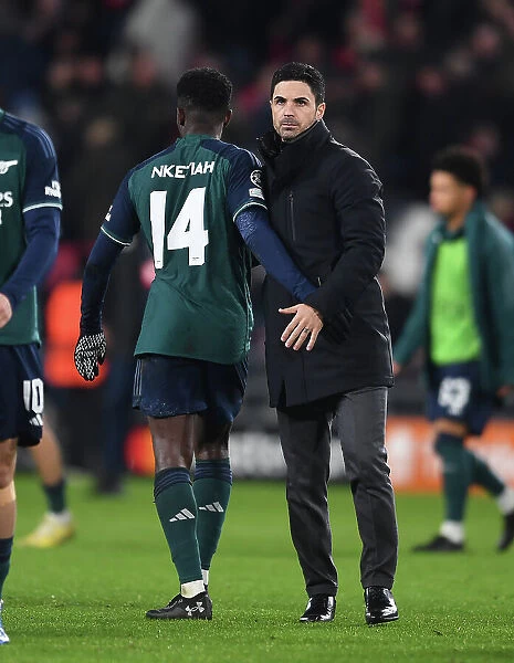 Arsenal's Victory at PSV Eindhoven: Eddie Nketiah and Mikel Arteta Celebrate in UEFA Champions League 2023 / 24