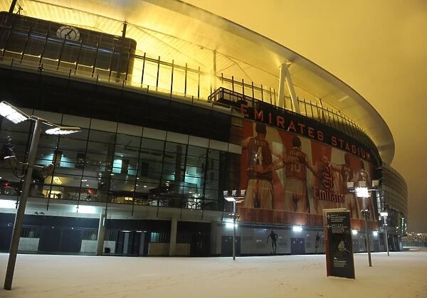 Arsenal's Winter Battle: Emirates Stadium vs. Blackburn Rovers in the Snowy Premier League, London 2012