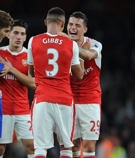 Arsenal's Xhaka and Gibbs: A Moment of Relief after Arsenal vs. Chelsea (2016-17)
