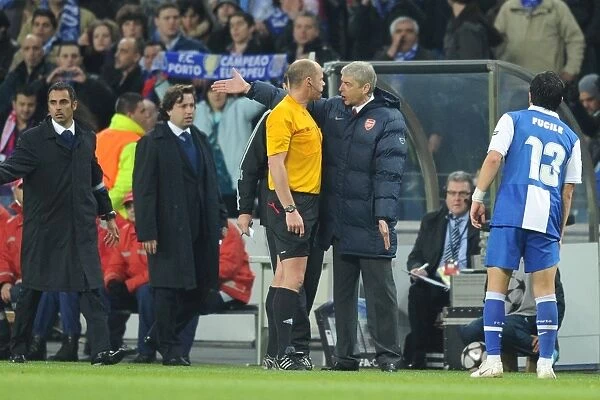 Arsene Wenger Argues with Referee Martin Hansson After Porto's Second Goal in UEFA Champions League Clash