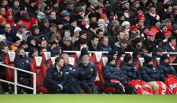 Arsene Wenger the Arsenal Manager sits in the dug out. Arsenal 2: 2 Everton