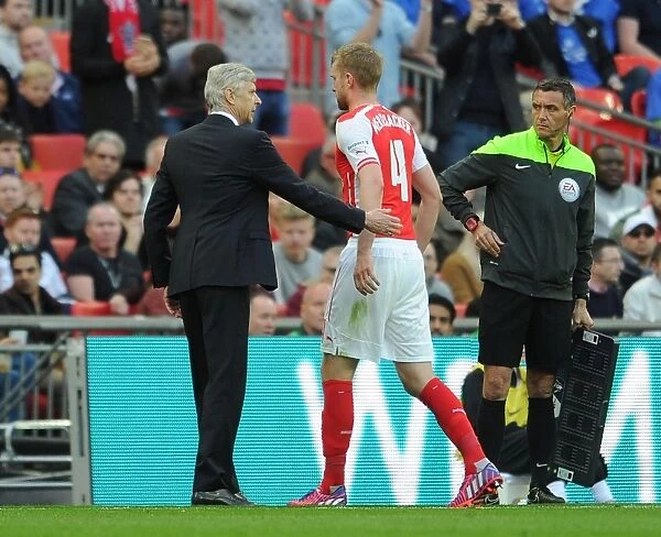 Arsene Wenger Comforts Substituted Per Mertesacker during FA Cup Semi-Final