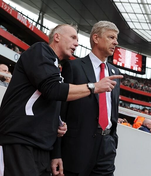 Arsene Wenger Conferring with Fourth Official Peter Walton at Arsenal vs. Sunderland (2011-12)