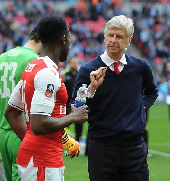 Arsene Wenger Consulting with Danny Welbeck during Arsenal's FA Cup Semi-Final Clash against Manchester City