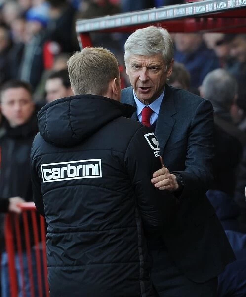 Arsene Wenger and Eddie Howe: A Pre-Match Handshake at the Bournemouth vs. Arsenal Premier League Match, 2016