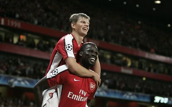Arshavin and Eboue: Arsenal's Unstoppable Duo Celebrates 2-0 Over Olympiacos in Champions League