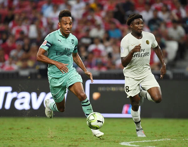 Aubameyang Outsmarts Mbe Soh: Thrilling Showdown Between Arsenal's Star Striker and PSG's Defender in International Champions Cup Clash