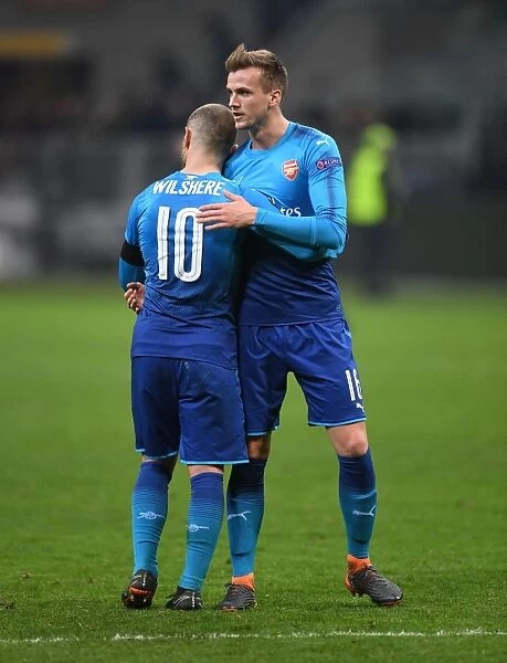 Camaraderie on the Field: Holding and Wilshere's Heartwarming Moment After Arsenal's Europa League Clash Against AC Milan
