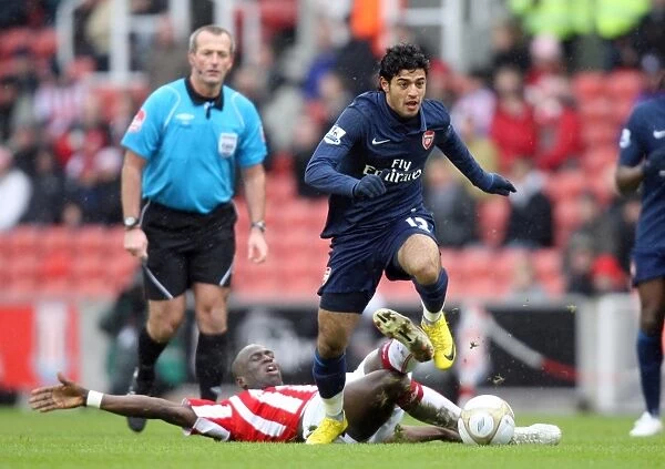 Carlos Vela (Arsenal) Mamady Sidibe (Stoke). Stoke City 3: 1 Arsenal. FA Cup 4th Round